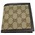 Cartera bi-fold Gucci GG Canvas en marrón Castaño