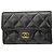 Tarjetero Chanel de piel de caviar acolchada Negro