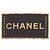 Spilla Chanel con placca logo in pelle e placcata oro D'oro