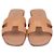 Hermès Hermes Oran Sandalen aus Leder in Pfirsich Angeln