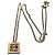 Collier chaîne Chanel doré avec médaillon CC