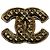 Broche Chanel dourada de metal Dourado