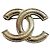 Broche Chanel forma CC en metal dorado
