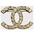 Broche Chanel CC dorado