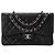 CHANEL - Borsa a tracolla Classic/Timeless Jumbo Chanel in pelle caviar nera Nero