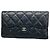 Cartera larga tri-fold Chanel de piel de cordero negra Negro