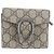 Cartera tri-fold de piel Gucci GG Supreme Dionysus Castaño