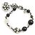 Pulseira com pingentes Chanel Preto Branco Metálico
