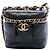 Piccola borsa vanity Chanel in pelle di vitello trapuntata nera con catena e borsa satchel Nero