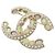 Broche Chanel en marrón, dorado, verde y blanco Castaño