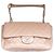 Chanel Classique Flap Bag em couro perfurado bege