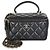 Chanel Vanity Case Piccolo in Pelle di Agnello Matelassé Nero con Manico Superiore e Catena