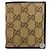 Tarjetero bi-fold de cuero y lona GG GUCCI