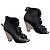 Stivaletti Chanel in pelle nera con camelia