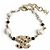 Bracciale Chanel con ciondolo perla eco e logo Coco in metallo dorato