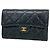 Cartera tri-fold Chanel de piel de cordero negra