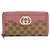 Portafoglio con zip Gucci GG Canvas Sukey