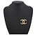Spilla Chanel in metallo dorato con logo Coco - vista 4