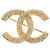 Spilla Chanel CC placcata oro con strass