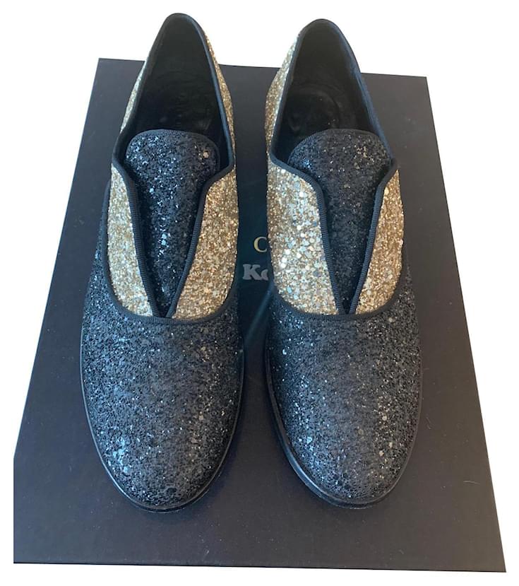 Tatoosh pair of moccasin sleepers with two-tone black and gold sequins ...