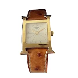 Hermès-reloj-Dorado