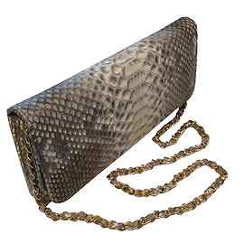 Autre Marque Clutch de pele de cobra com corrente dourada Outro