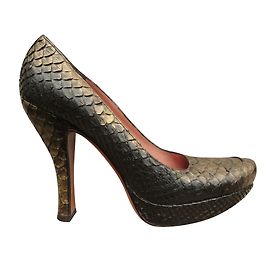 Tacones Alaïa de Pitón Dorado Dorado