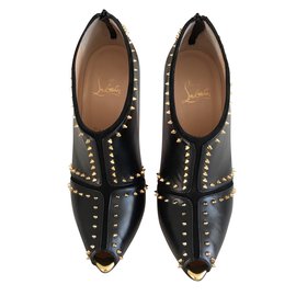 Christian Louboutin-Stivaletti modello Caraphachoc nero e oro-Nero