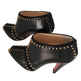 Christian Louboutin-Stivaletti modello Caraphachoc nero e oro-Nero