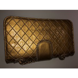 Chanel-Bolsos de mano-Dorado,Amarillo