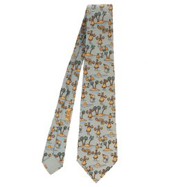 Hermès-Cravate Hermès en soie à motifs "Palmier & danseuse tahitienne" en très bon état !-Bleu clair