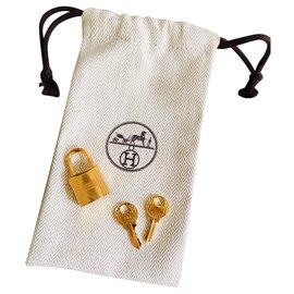Hermès-Cadeado Hermes dourado para Birkin ouro kelly sacos, neuf 2 chaves e pochon!-Dourado