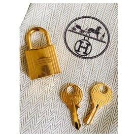 Hermès-Cadeado Hermes dourado para Birkin ouro kelly sacos, neuf 2 chaves e pochon!-Dourado