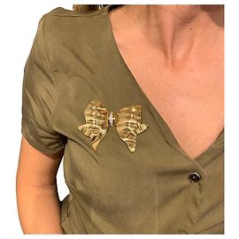 Broche Repossi "nó" em ouro amarelo e branco, diamantes. Outro