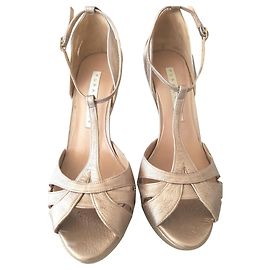 Pura Lopez Mules compensées talons aiguilles. Métallisé