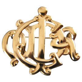 Christian Dior-monograma-Dorado
