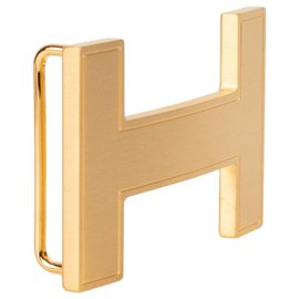 Hermès-Fivela de cinto Hermes modelo "Quiz" em metal dourado escovado, Nova Condição!-Dourado