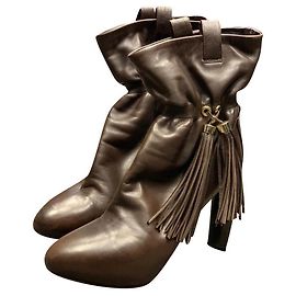 Botas Céline de piel marrón con detalles de pompón Marrón oscuro