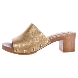 Diane Von Furstenberg Mules en cuir doré DvF Doré