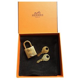 Hermès-Cadeado dourado Hermès para bolsa Birkin ou Kelly Novo-Dourado