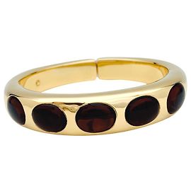 Pulseira Pomellato "Bisanzio" em ouro amarelo e granadas. Outro