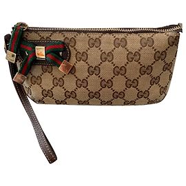Pochette Gucci en toile monogramme et cuir Chataigne