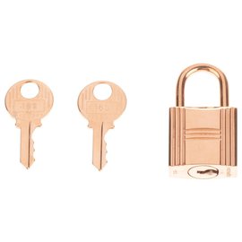 Hermès-Hermes, Cadeado Hermès em metal dourado para bolsas Birkin, Kelly, nova condição com 2 chaves e bolsa original!-Dourado