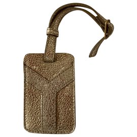 Yves Saint Laurent Étiquette de voyage en cuir doré Doré
