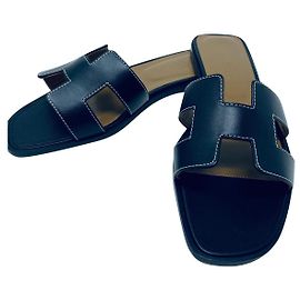 Hermès HERMES ORAN BLACK FLAT SANDALS NEW Black
