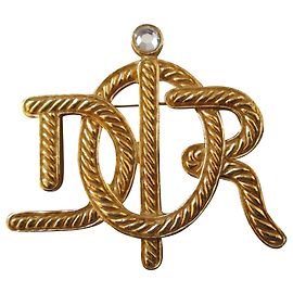 Christian Dior Broche plaqué or. Doré