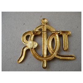 Christian Dior-Broche plaqué or.-Doré