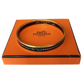 Bracelet Hermès en émail et plaqué or Doré