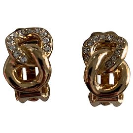Brincos de encaixe Dior dourados em aço Dourado