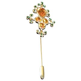 Broche Yves Saint Laurent em metal dourado com vidro âmbar e esmalte verde Multicor
